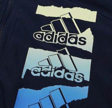 adidas Essentials Brandlove Herren Windbreaker für 30,94€ (statt 39€)